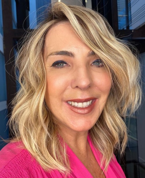 Mature Hair Layered Cut Medium Length Hairstyle with Deep Side Part for Older Women