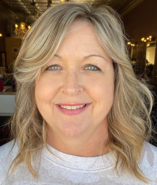 Mid-Length Cut with Side Bangs Medium Length Hairstyle for Older Women with Round Face Shape