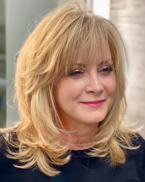 Medium Length Feathered Hair Over 60 Midi Cut with Flipped Up Ends