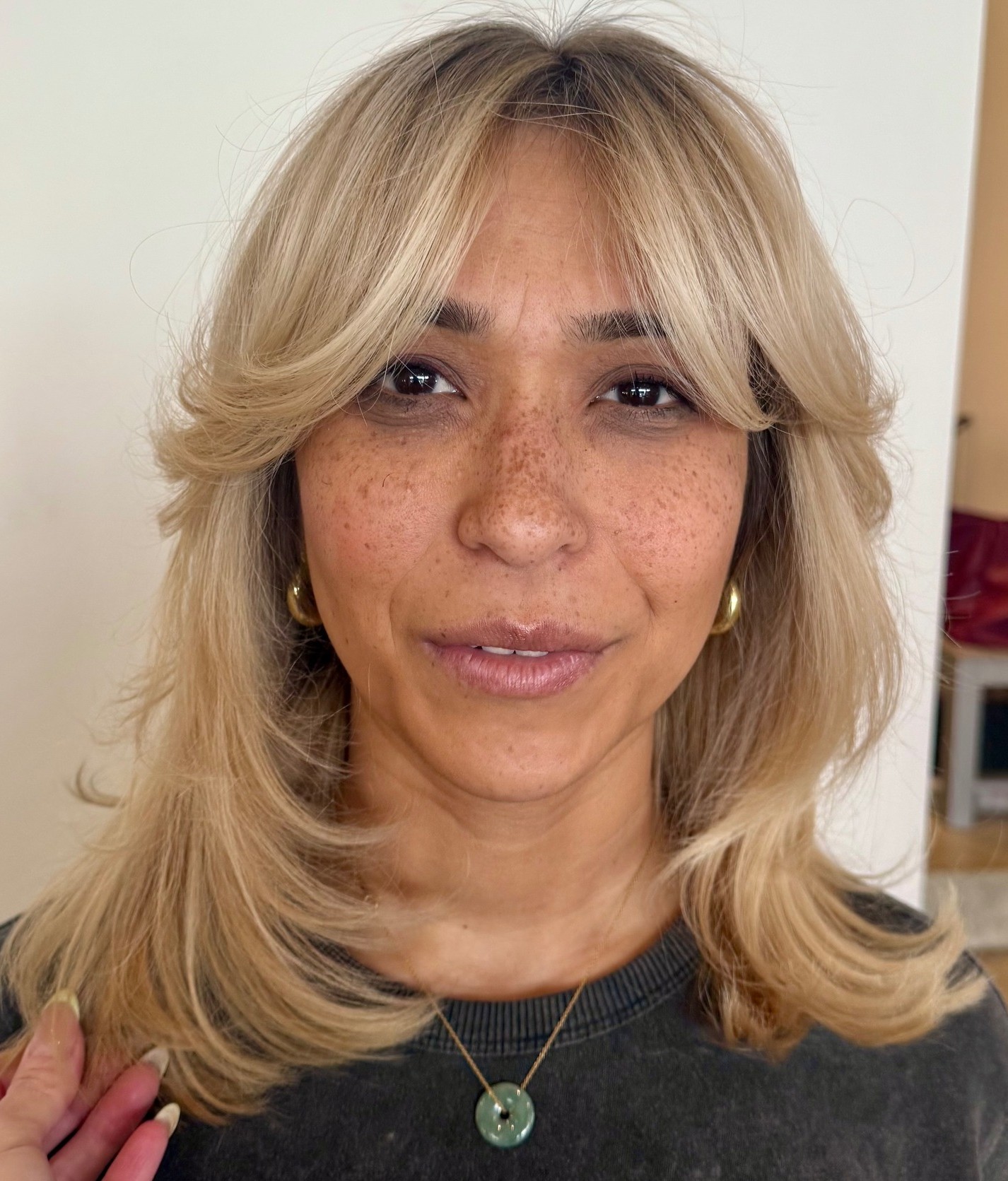 Over Flipped-Up Hairstyle with Wispy Bangs