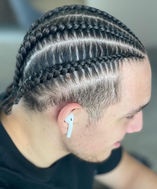 Cool Cornrow Braids for Men Braids into Low Men Bun with Undercut Temples