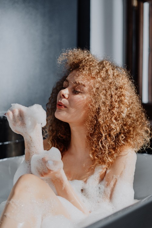 Woman with Coily Hair Taking a Bath